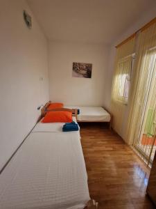 Postel nebo postele na pokoji v ubytování Apartments Glibo