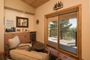 a living room with a large sliding glass door at Rincon Ridge Road in Durango +67 photos