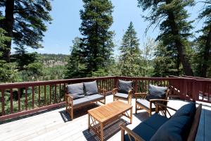 a deck with chairs and a table and a couch at 246 Beaver Circle in Durango Mountain Resort