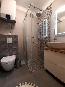 Koupelna v ubytování Solis Adriaticum Apartments