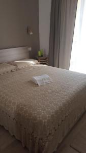 Ένα ή περισσότερα κρεβάτια σε δωμάτιο στο Casa Vacanza Cundari
