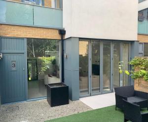a building with a door and a bench in front of it at Luxury 4 bed home in Central London in London