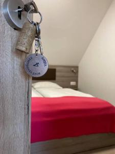 a bedroom with a bed with a lock on the door at Rozé Vendégház in Villány