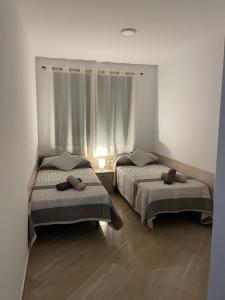 Postel nebo postele na pokoji v ubytování Moraira Calamora
