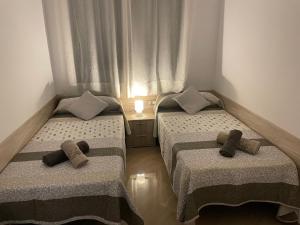 Postel nebo postele na pokoji v ubytování Moraira Calamora