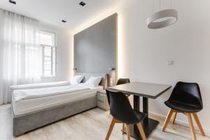 Posteľ alebo postele v izbe v ubytovaní Lampi Aparthotel Prague