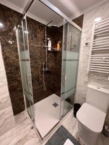 a bathroom with a shower and a toilet at Orihuela Costa 3 bdr condo on La Zenia beach with patio in Orihuela +22 photos