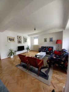 a living room with a couch and a table at Katerina Apartment in Ohrid