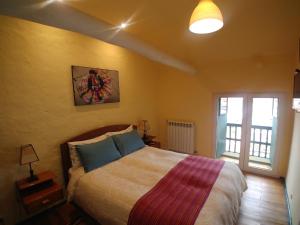 Ein Bett oder Betten in einem Zimmer der Unterkunft Hostal Corihuasi