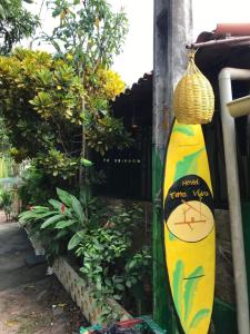 a surfboard on the side of a fence at Hostel Terra Viva in Pipa