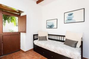 En eller flere senge i et værelse på CASA CANARIA ACERÓ
