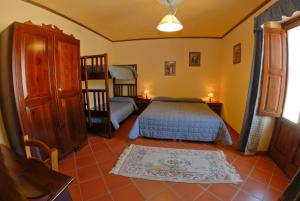 a bedroom with a bed and a staircase in it at Hotel Valle dell' Oro in Pescasseroli +20 photos