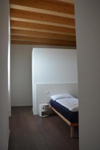 מיטה או מיטות בחדר ב-Palazzo Oltre