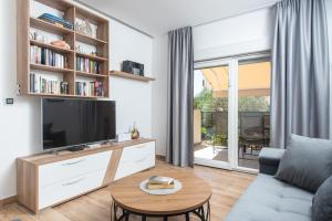 TV a/nebo společenská místnost v ubytování Apartment Kiki