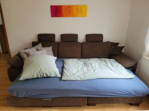 a bed with two pillows on it in a room at Ferienwohnung Sonnenschein in Obernkirchen