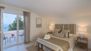 Posteľ alebo postele v izbe v ubytovaní Villa Torium Vélez-Málaga by Ruralidays + 37 fotografií