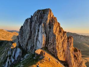 a group of people standing on top of a mountain at Apartments Snowflake in Žabljak +9 photos