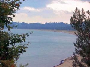 a view of a body of water with trees at Ruegen_Fewo 63 in Garz-Rügen