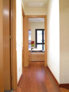 an empty hallway with a door leading into a room at Olles Apartment in Barcelona