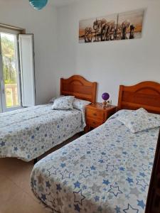 A bed or beds in a room at Casa Amarela
