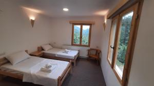 Postel nebo postele na pokoji v ubytování Hotel Ravnjak