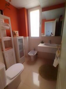 a bathroom with a white toilet and a sink at Apartamento Mojacar Playa in Mojácar