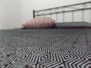A bed or beds in a room at Echoes of Pleasure