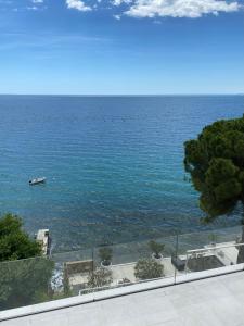 a view of a body of water with a boat in it at Seaside Resort in Trieste