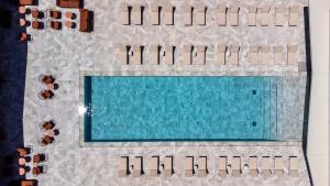 an overhead view of a swimming pool with people at Hôtel Spa Restaurant Villa Castellane by Germain Collection in Gréoux-les-Bains