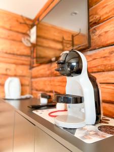 a coffee maker sitting on top of a counter at Jūras Pērle in Tūja