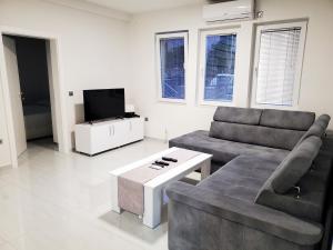a living room with a couch and a table at Villa Koki in Ohrid