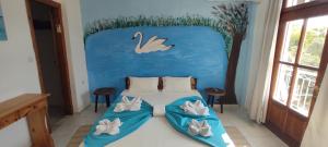 Letto o letti in una camera di Amaranthos Skiathos View