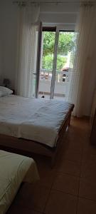 Postel nebo postele na pokoji v ubytování Apartments Josko Barbat