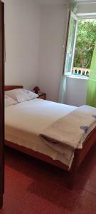 Postel nebo postele na pokoji v ubytování Apartments Josko Barbat