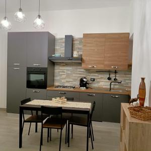 Kuchyň nebo kuchyňský kout v ubytování Antico Cortile