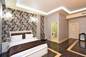 Ένα ή περισσότερα κρεβάτια σε δωμάτιο στο Macao Hotel