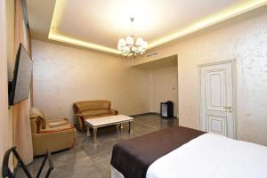 Ένα ή περισσότερα κρεβάτια σε δωμάτιο στο Macao Hotel