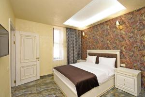 Ένα ή περισσότερα κρεβάτια σε δωμάτιο στο Macao Hotel