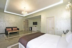 Ένα ή περισσότερα κρεβάτια σε δωμάτιο στο Macao Hotel