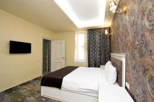 Ένα ή περισσότερα κρεβάτια σε δωμάτιο στο Macao Hotel