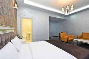 Ένα ή περισσότερα κρεβάτια σε δωμάτιο στο Macao Hotel