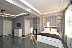 Ένα ή περισσότερα κρεβάτια σε δωμάτιο στο Macao Hotel