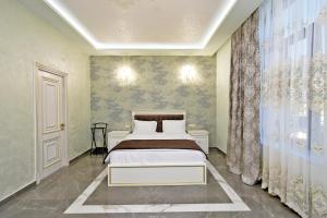 Ένα ή περισσότερα κρεβάτια σε δωμάτιο στο Macao Hotel