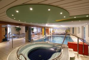 a large swimming pool in a building at Hotel Thier in Mönichkirchen