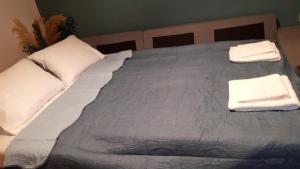 Postel nebo postele na pokoji v ubytování Sitia Cozy Apartment