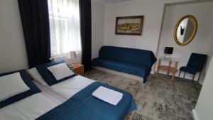 Posteľ alebo postele v izbe v ubytovaní Apartamenty i pokoje gościnne KOŁODZIEJÓWKA