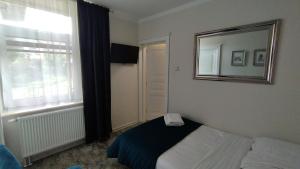 Posteľ alebo postele v izbe v ubytovaní Apartamenty i pokoje gościnne KOŁODZIEJÓWKA