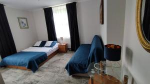 Posteľ alebo postele v izbe v ubytovaní Apartamenty i pokoje gościnne KOŁODZIEJÓWKA