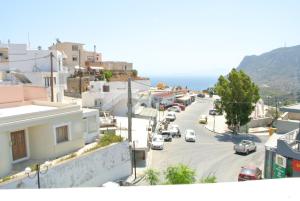 a view of a city street with cars parked at central square HOUSE kokalaki in Kefalos