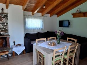 A television and/or entertainment centre at Traditional house in Akamatra square